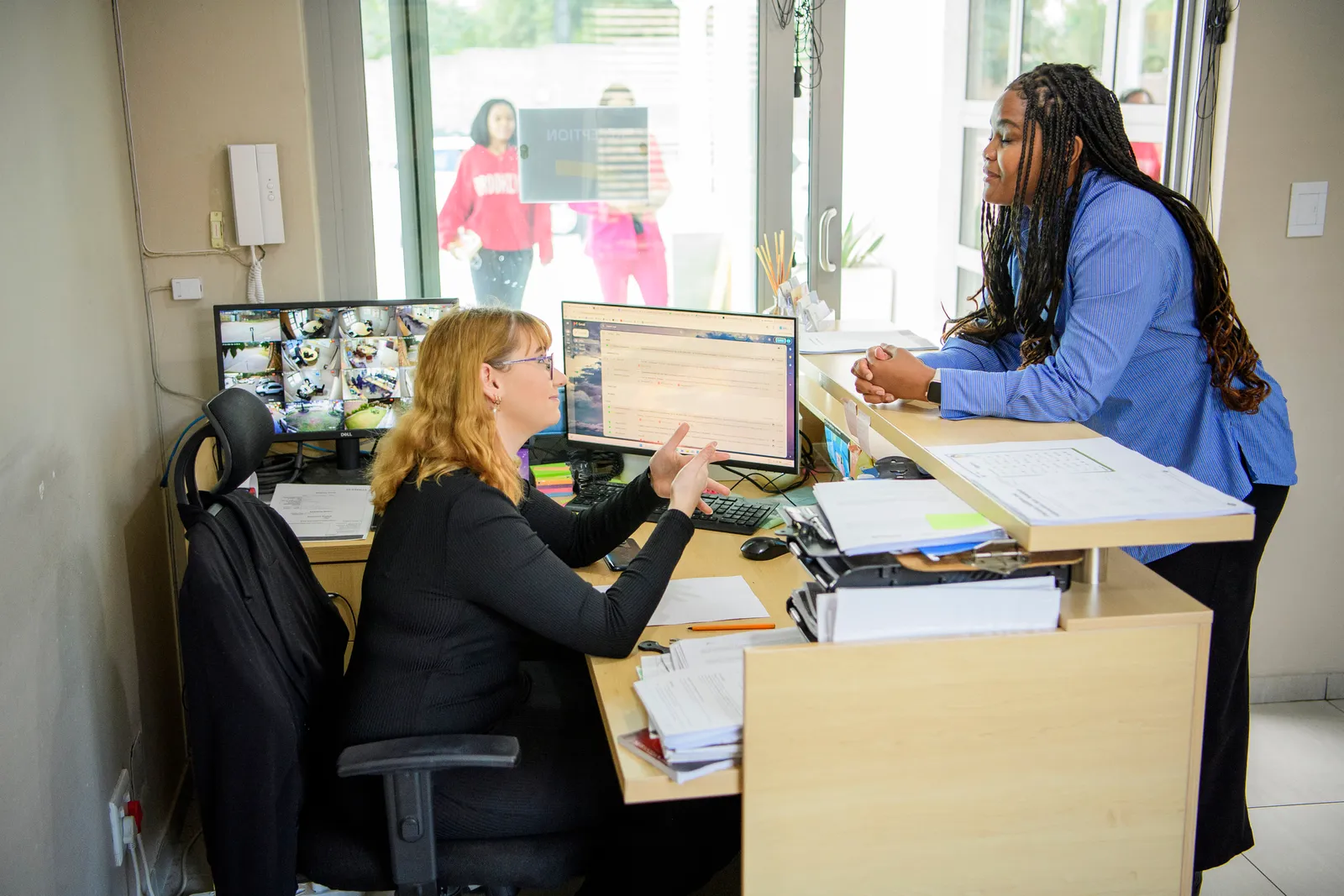 A family being welcomed at the Genius assessment centre reception