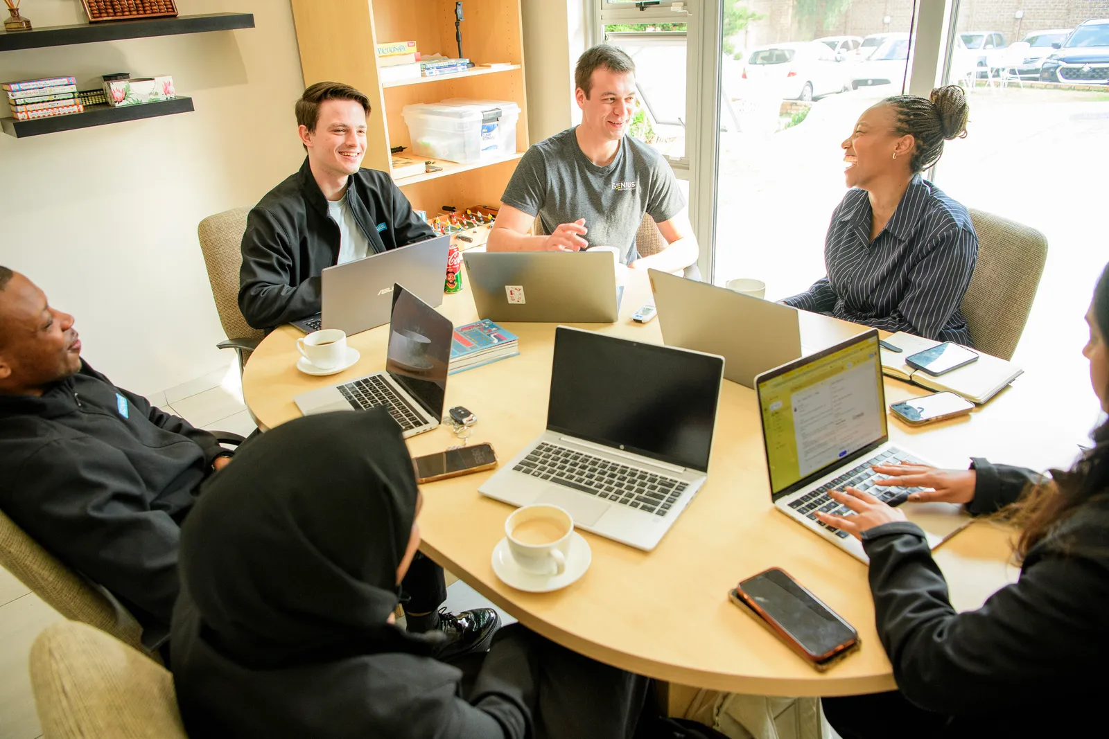 The Genius team sharing a candid moment during a working session