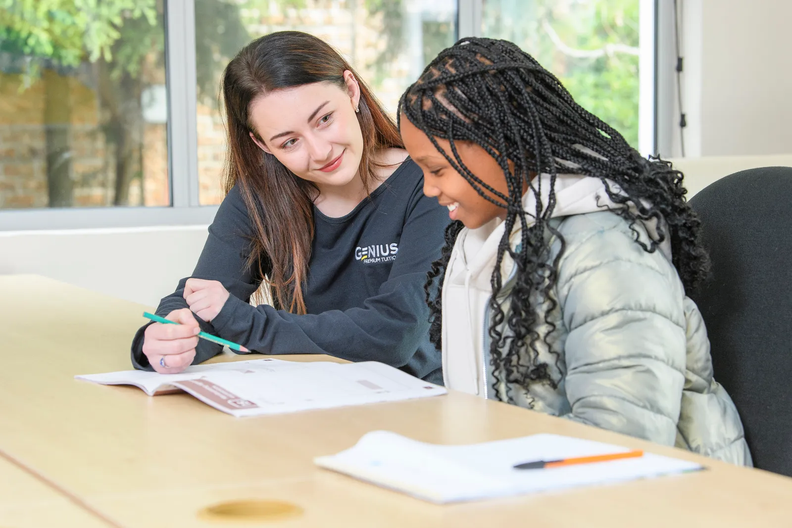 A Genius tutor and student enjoying a one-to-one lesson